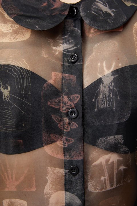 Blusa gótica transparente con hombros abullonados